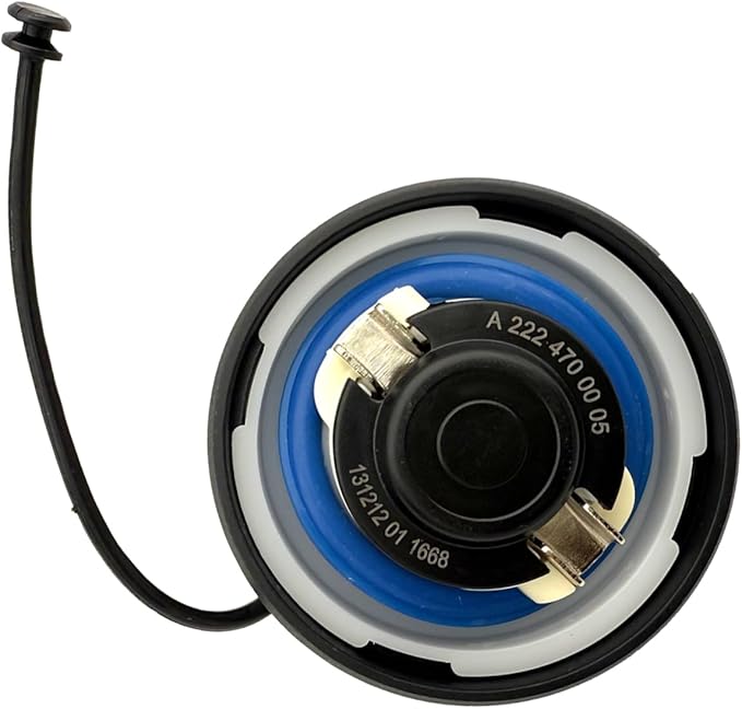 Bottom view of Mercedes fuel cap showing rubber seal and locking clamps