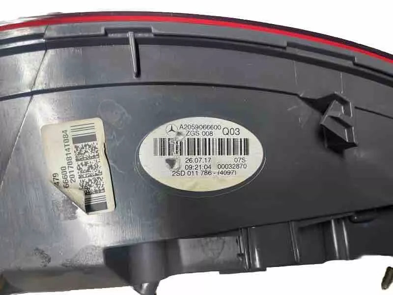 Close-up of Mercedes OEM label and part number A2059062002 on right taillight