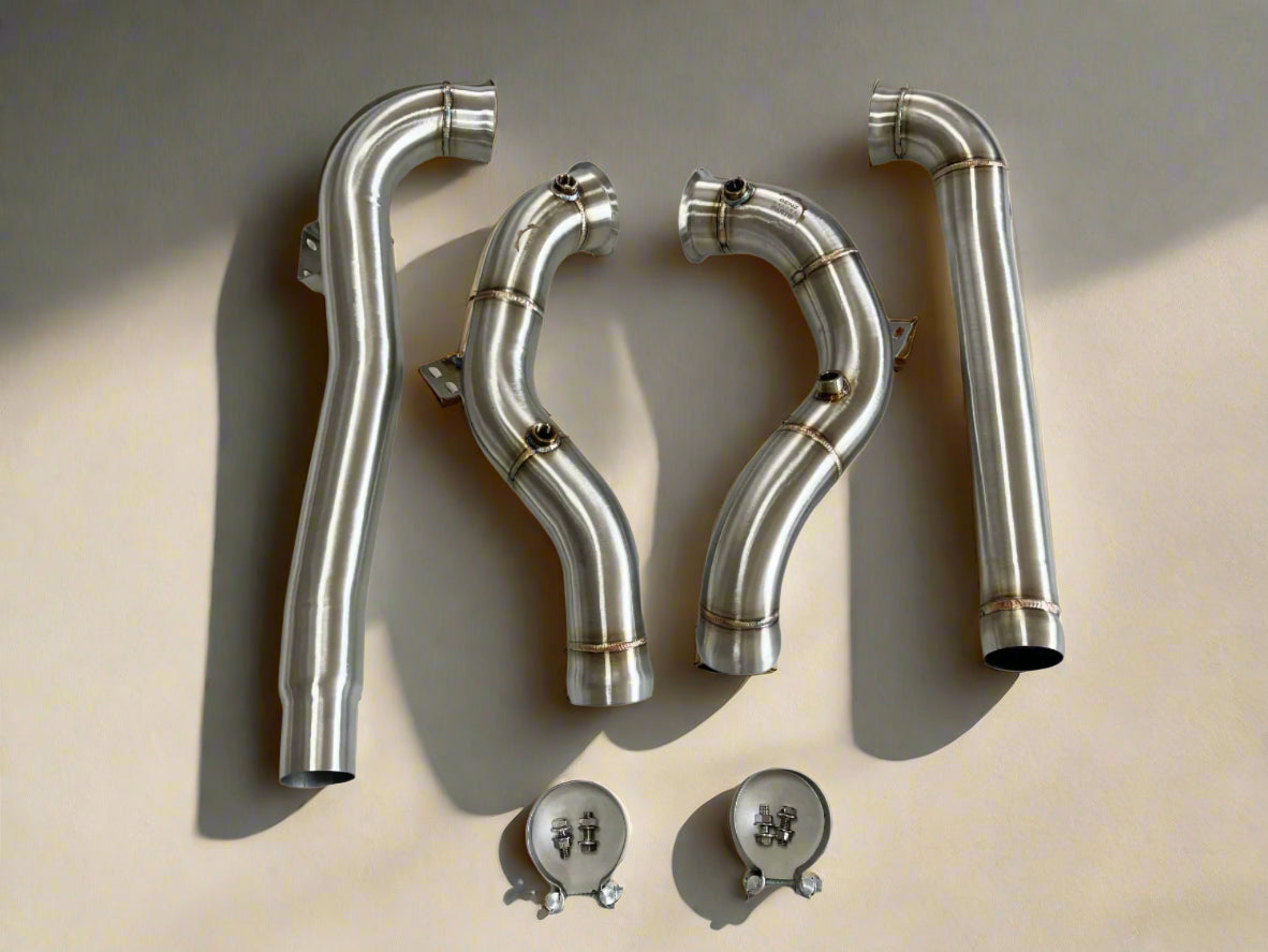 High-performance stainless steel downpipes for Mercedes-AMG W213 E63 and E63s, designed for maximum power and aggressive sound
