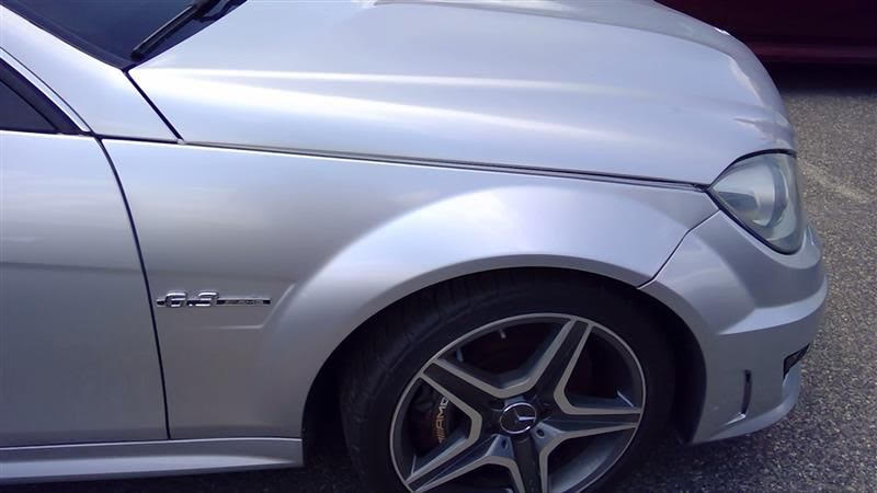 Side profile of Mercedes-Benz C63 AMG W204 with factory 18-inch front AMG alloy wheels installed