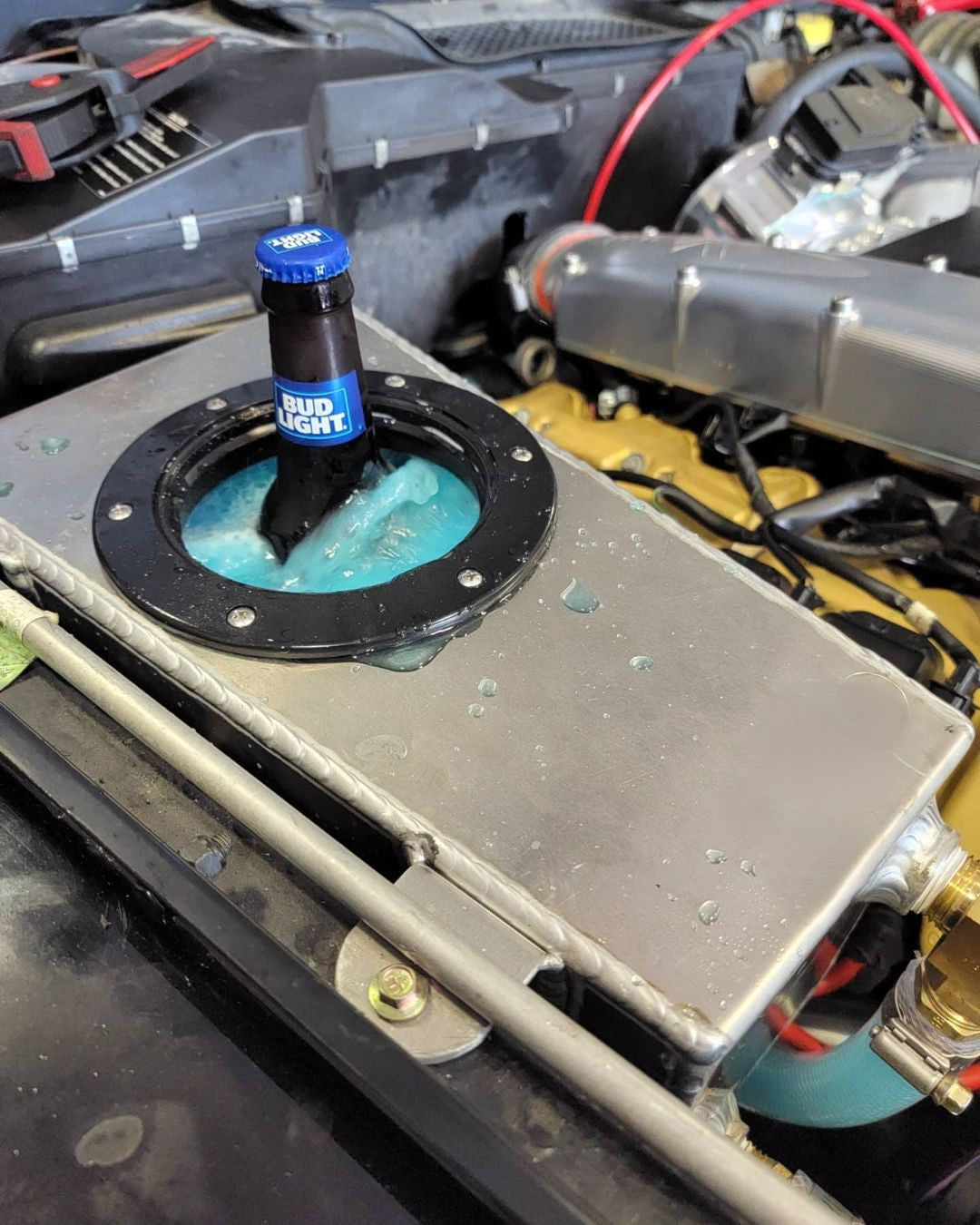 Under Hood Ice Tank installed in G55 AMG with coolant hose connected