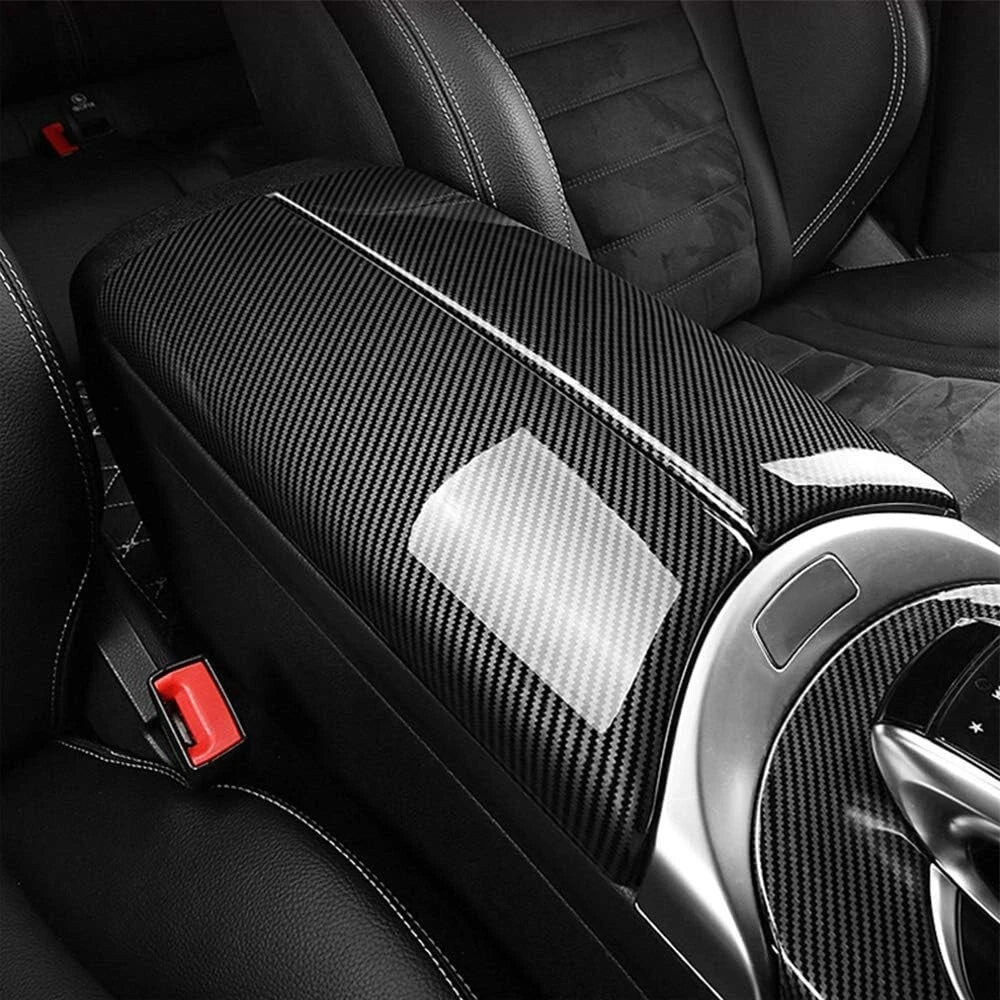 Driver-side view of carbon fiber style armrest lid cover installed