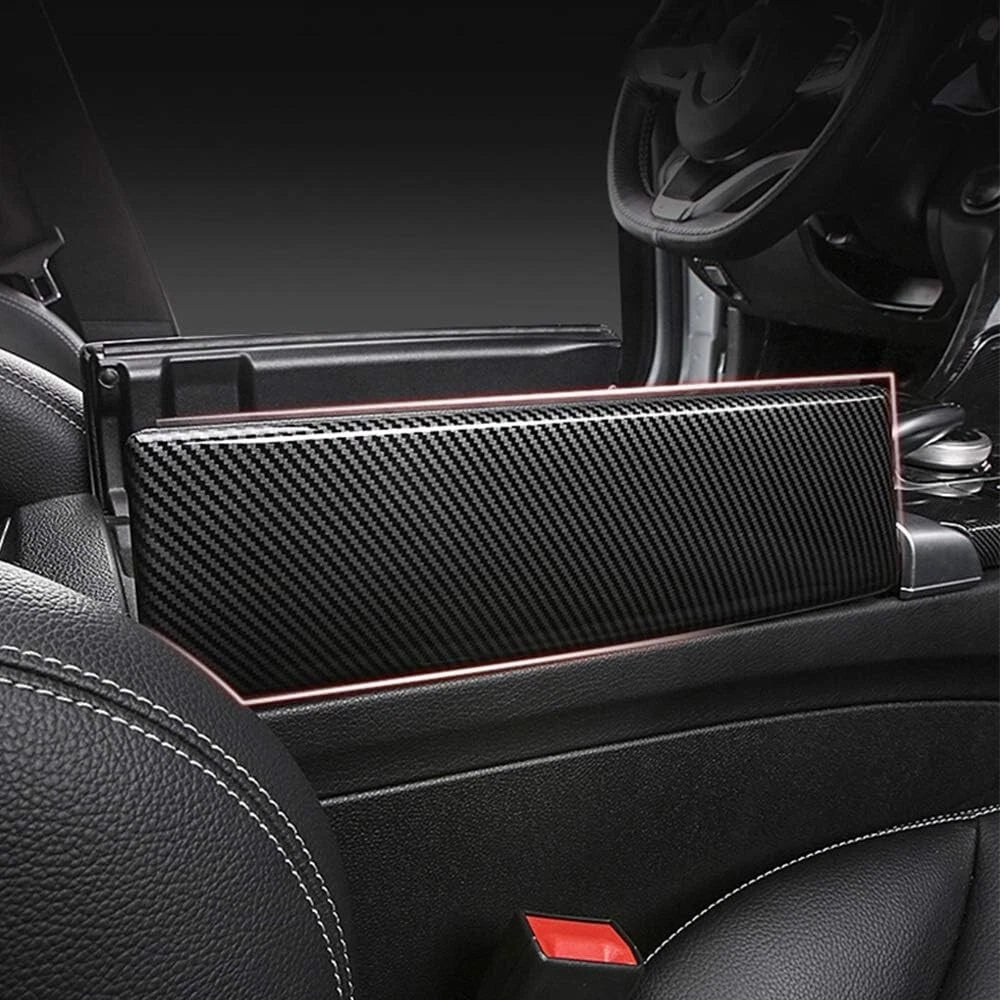 Opened armrest console with carbon lid replacement installed