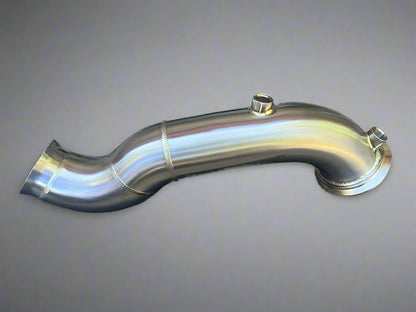 Metallic exhaust pipe on a concrete surface