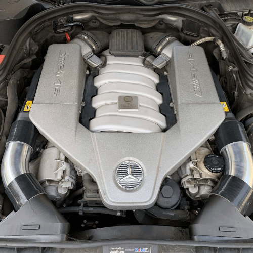 Pair of aluminum intake tubes for Mercedes-Benz 63 AMG M156 engine, showing full performance upgrade kit with couplers and adapters