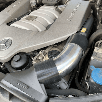 Single aluminum intake tube for Mercedes AMG M156 platform, highlighting polished finish and smooth internal airflow design