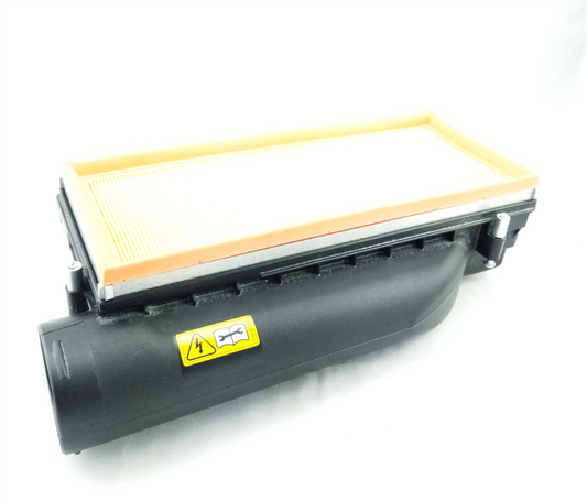 Mercedes-Benz M157 intake airbox with spacer kit installed – top view of filter housing showing airflow optimization design.