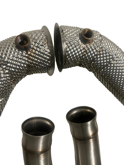 Close-up of flange and connection on heat shielded catless downpipes for Mercedes C63 AMG M177