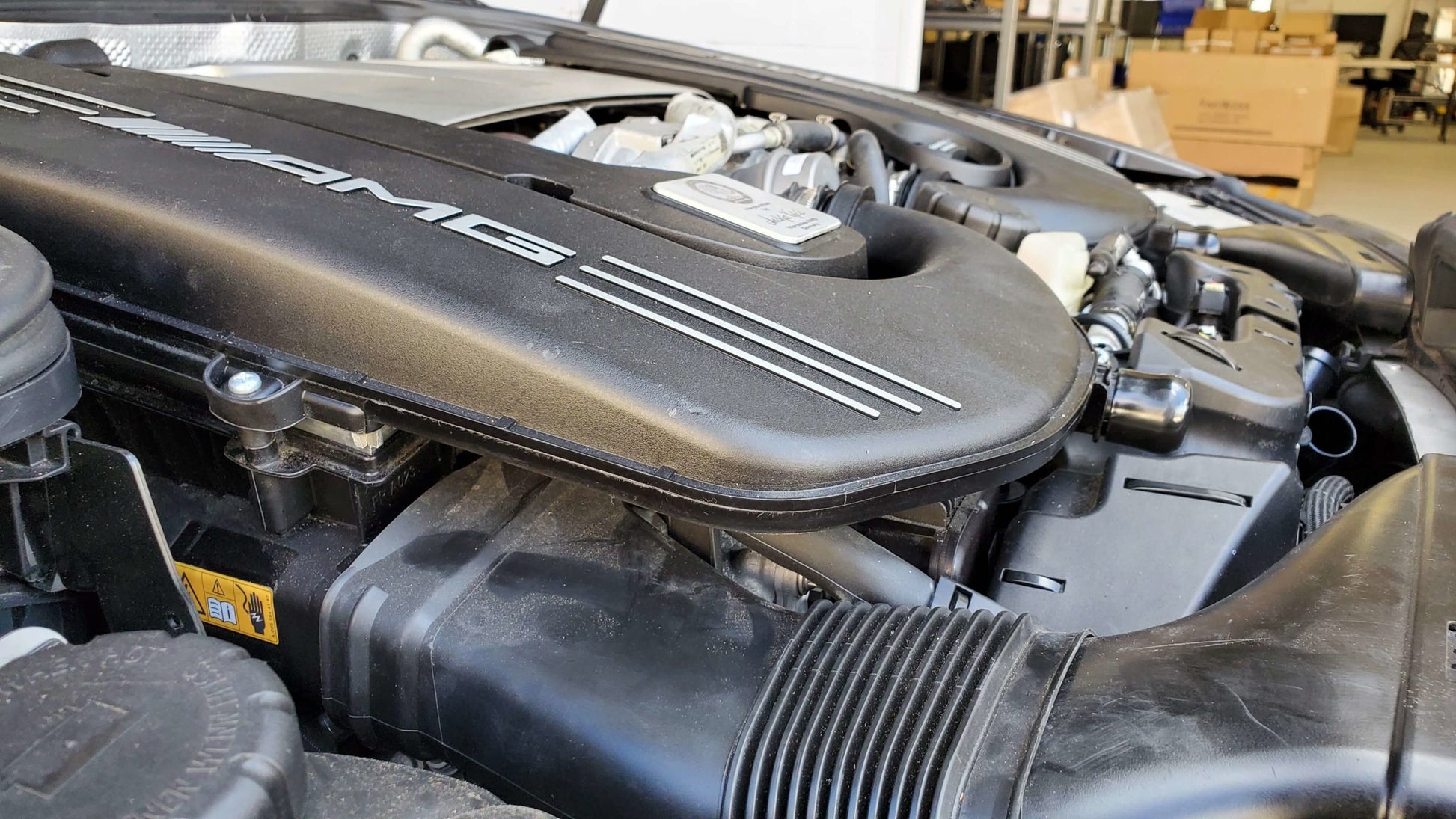 C63 AMG M177 engine bay with intake spacer kit installed