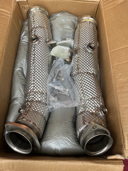 Mercedes M276 catless downpipes – in-box view with packaging and hardware