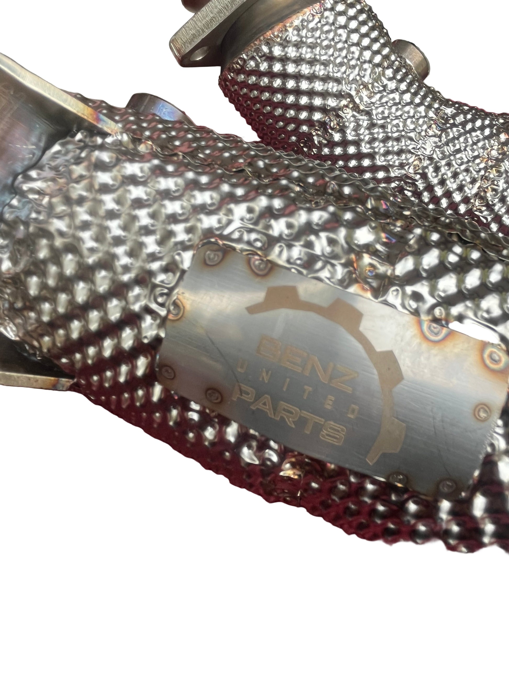 Close-up of TIG welds and integrated heat shielding on Mercedes M276 catless downpipes for E-Class models