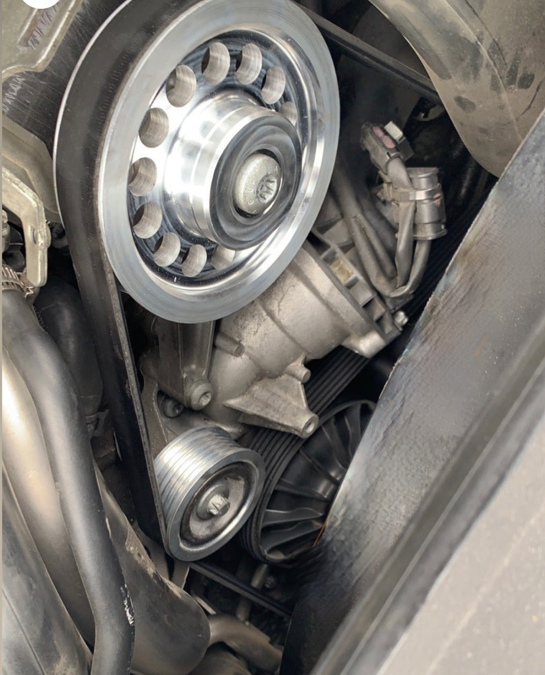 Installed M278 Billet Pulley Set on Mercedes-Benz E550 engine bay showing precise CNC fitment