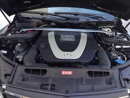 Megan Racing W204 front strut tower bar installed on Mercedes-Benz C-Class engine bay
