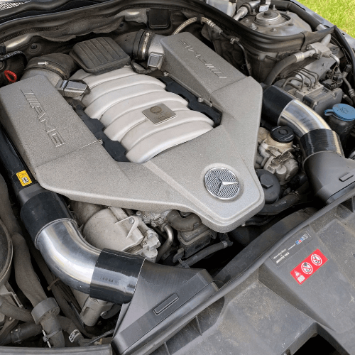 Aluminum intake tubes installed on Mercedes-Benz 63 AMG M156 V8 engine, showing improved airflow and clean engine bay design