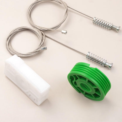 Mercedes-Benz CLK cabriolet rear quarter window regulator repair kit parts laid out — cable, white carrier and green pulley