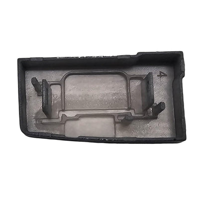 Underside of the black M switch button cap showing the mounting clips