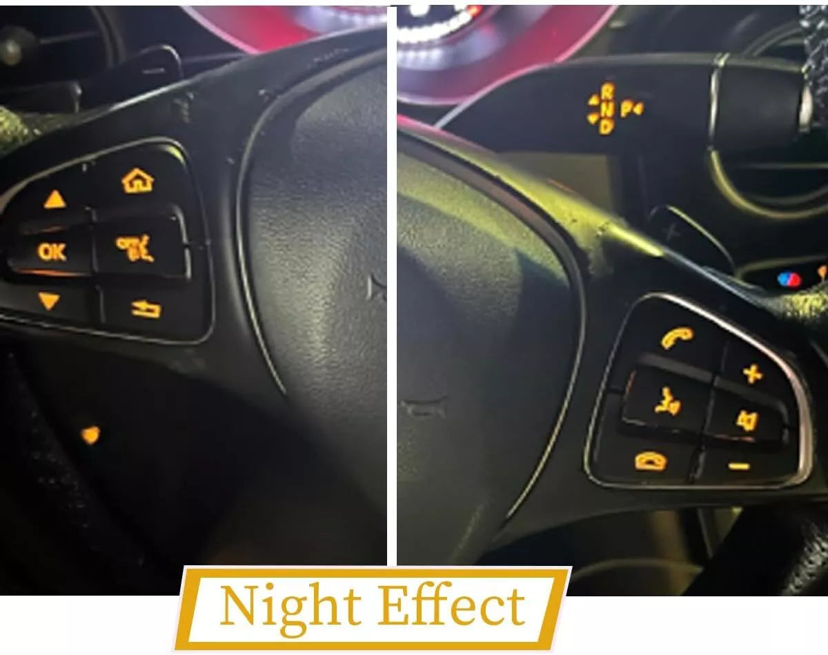 Installed black button overlays at night with the factory backlighting showing through