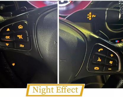 Installed black button overlays at night with the factory backlighting showing through
