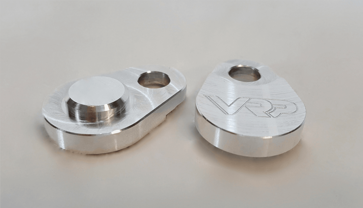 Top view of billet aluminum SAI block-off plates for Mercedes engines – CNC-machined performance part.