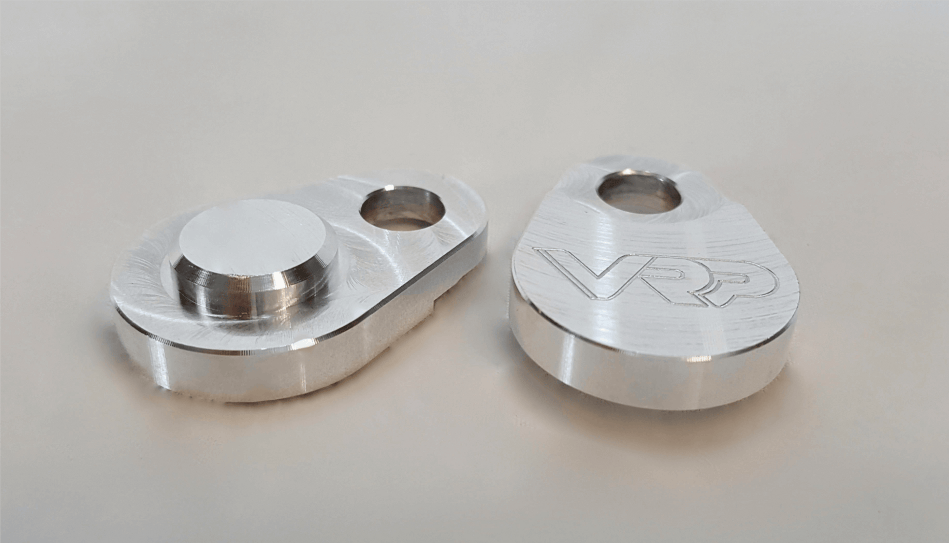 Top view of billet aluminum SAI block-off plates for Mercedes engines – CNC-machined performance part.