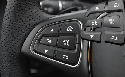 Black Mercedes steering wheel button covers installed on the steering wheel controls