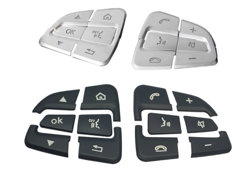 Silver and Black Mercedes steering wheel button cover set on a white background