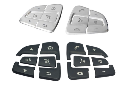 Silver and Black Mercedes steering wheel button cover set on a white background