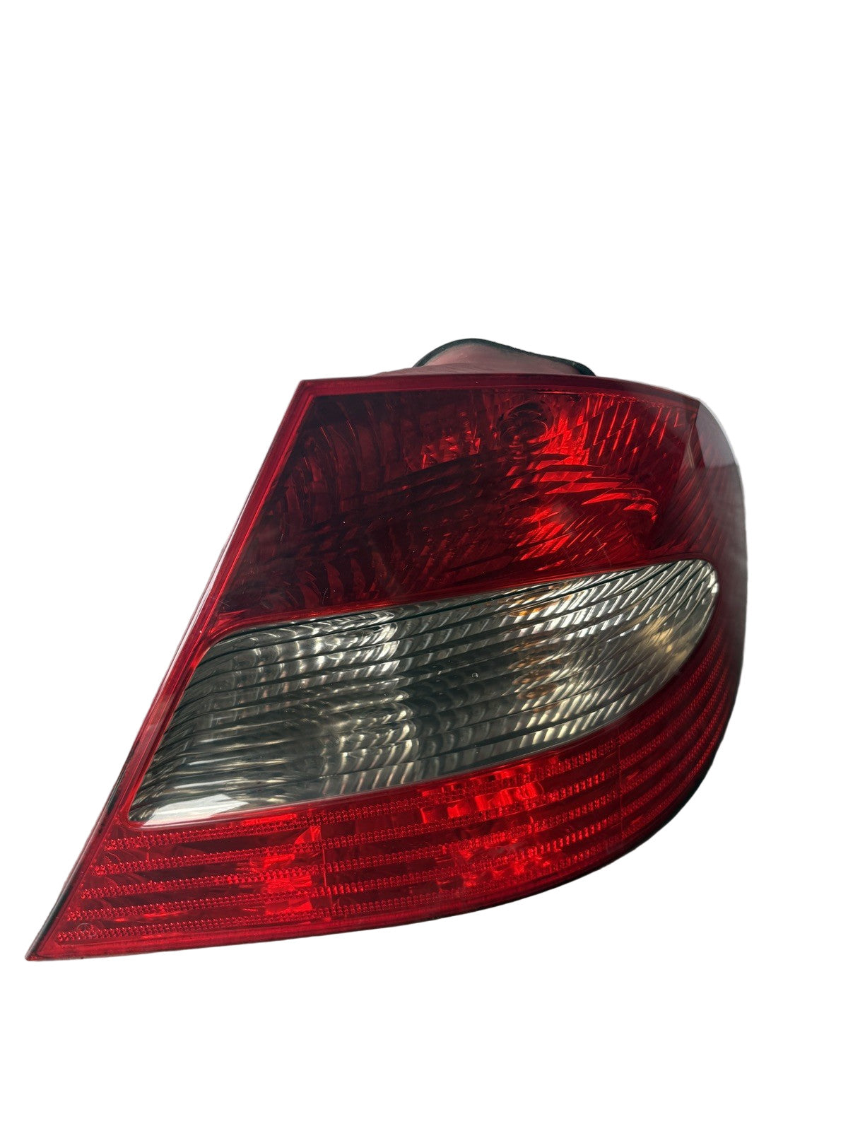Front lens close-up of used OEM Mercedes CLK-Class W209 right LED taillight 2098201464 - clear and undamaged