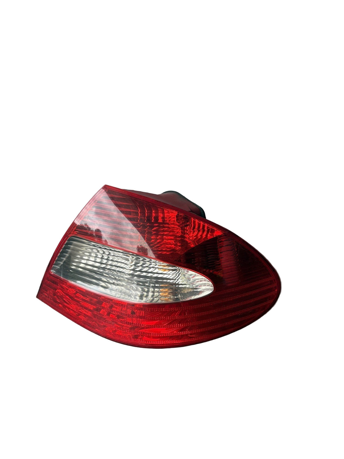 Side profile view of genuine used Mercedes W209 CLK right LED taillight 2098201464 showing housing and mounting tabs