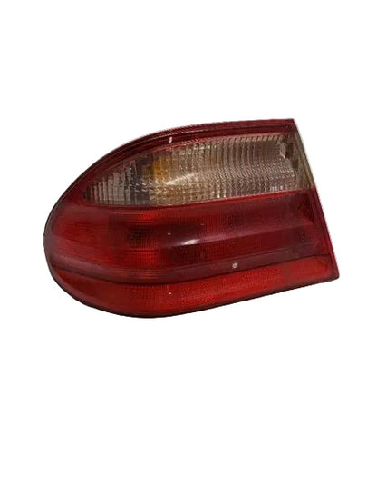 Clear lens close-up of used OEM Mercedes W210 E-Class left outer tail light 2108203564 - facelift model 2000-2002