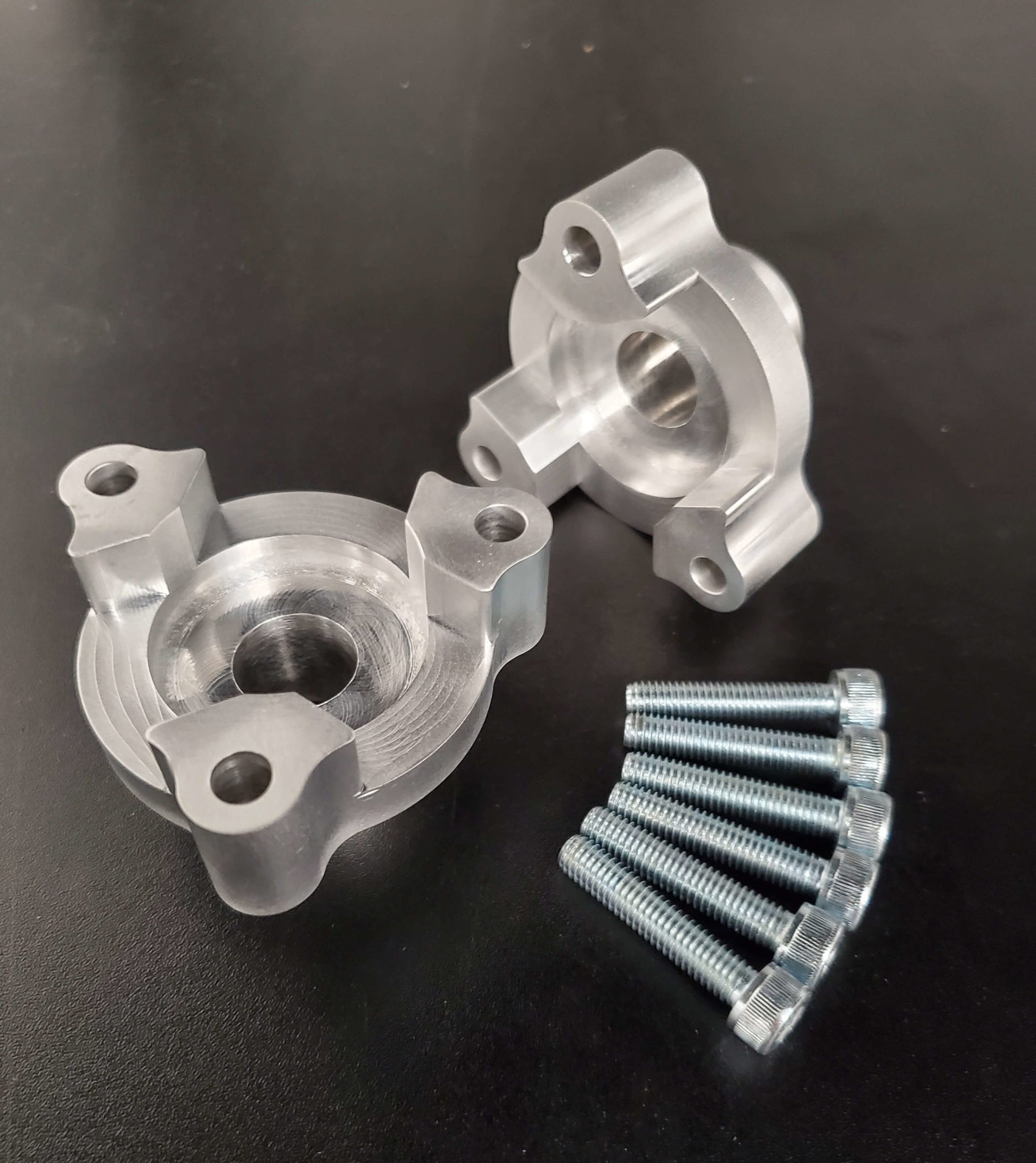 VTA adapter kit with bolts on black surface – Mercedes E63S AMG compatible
