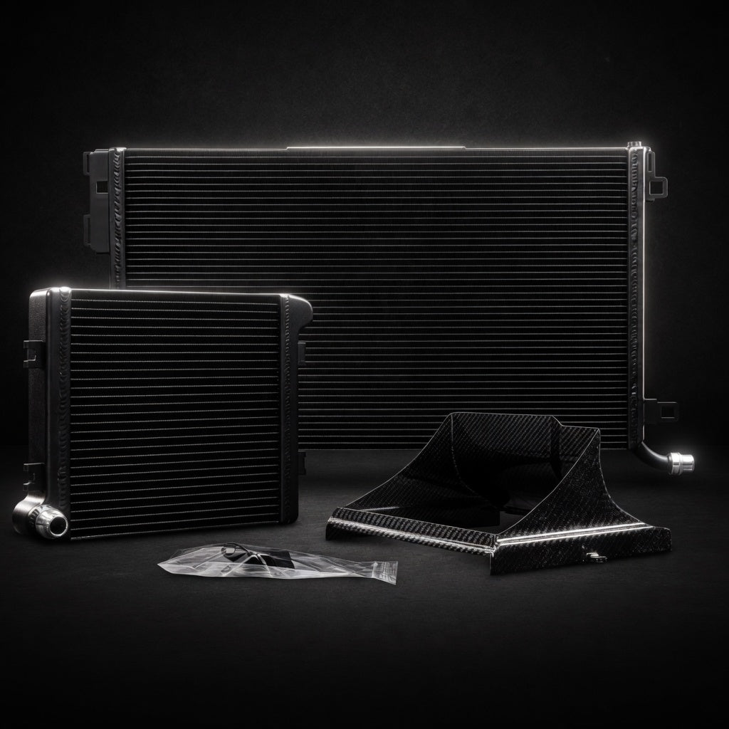 Premium dark background product shot of W205 C63 / C63S Front Mount + Auxiliary Heat Exchanger Bundle with carbon parts