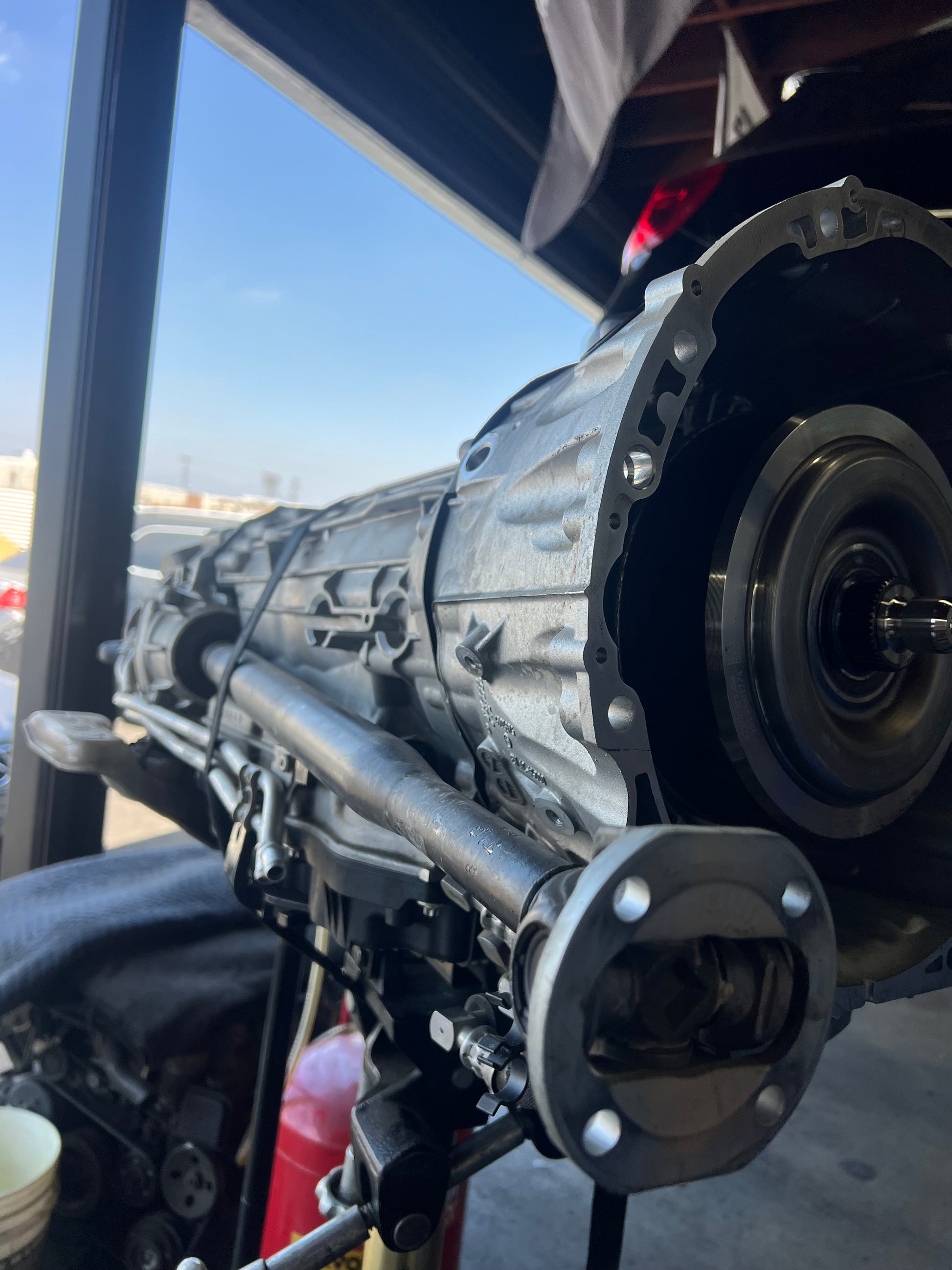 Mercedes-AMG W213 E63S transmission removed during catless downpipe installation